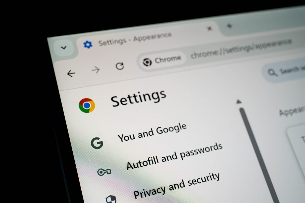 Decorative image of a close-up of the Google Chrome Settings page showing options for autofill, passwords, privacy, and security.
